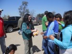 Carol & David hand out sandwiches.