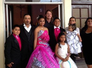 Wayne with Carlos' family last year at his daughter's quinceañera. 